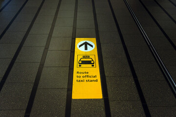 Direction to official taxi stand on the sidewalk of Schiphol International airport, the Netherlands - 570291247