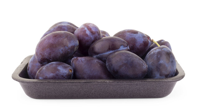Ripe plum with green leaf. With clipping path