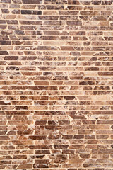 Designer brown and black brick wall. Close-up
