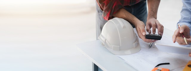 Architects and engineers are working together to edit the draft house plan that was designed after it was presented to the client and partially revised the design. Interior design and decoration ideas