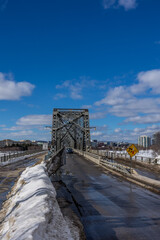 Having a walk in the Majors Hill Park in downtown Ottawa Canada with view to the historical Alexandra bridge at a cold but sunny day in winter.