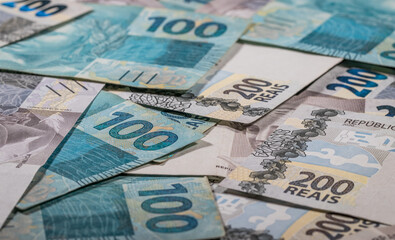 Background and texture with Brazilian Reais banknotes.