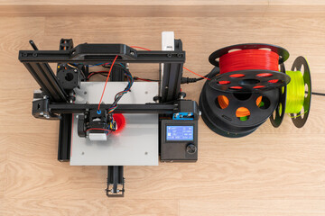 Modern 3D printer and multi-colored filament spools