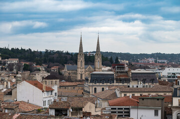 Fototapeta na wymiar Nîmes, Occitanie, France - Skyline over old town with the twin towers of the Saint Baudilus Church