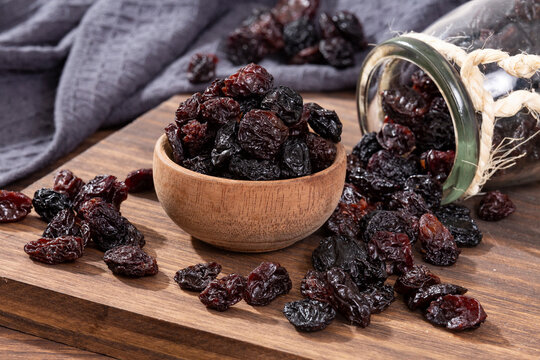 Healthy Food - Nuts Dehydrated Grapes; Photo On Wooden Background