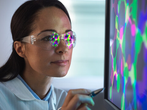 Close-up of scientist designing chemical formula