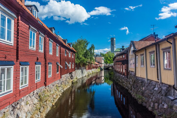 Fototapeta na wymiar Colorful houses by the canal in the city center of Vasteras, Sweden