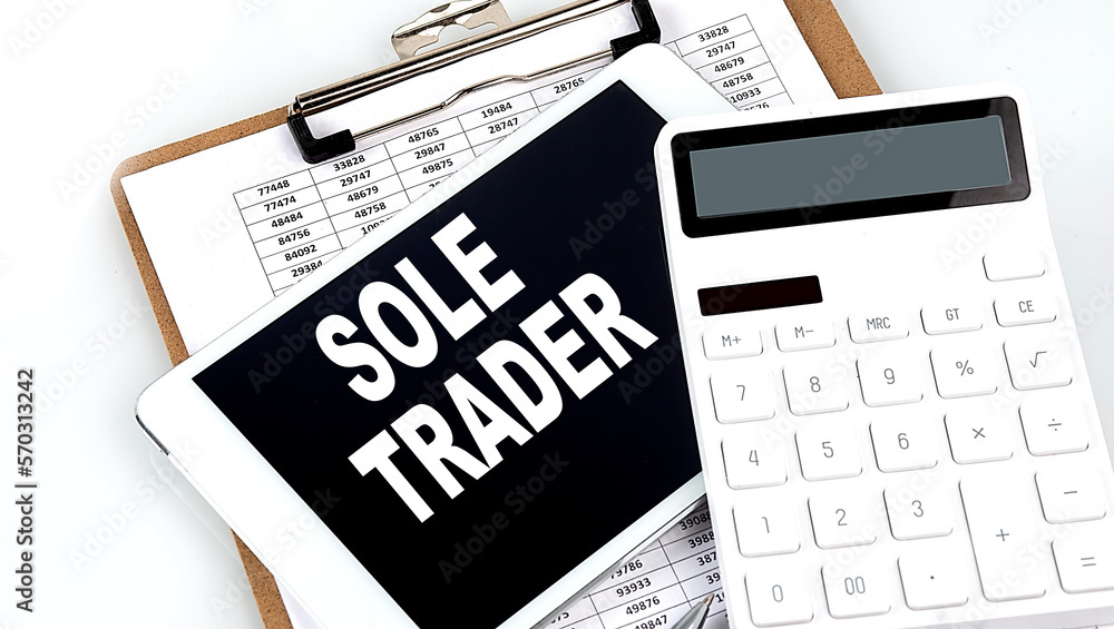 Poster sole trader text on a tablet with chart, calculator and pen
