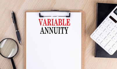VARIABLE ANNUITY text on a clipboard on wooden background
