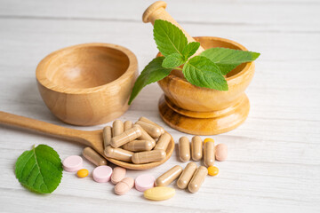 Alternative medicine herbal organic capsule with vitamin E omega 3 fish oil, mineral, drug with herbs leaf natural supplements for healthy good life.