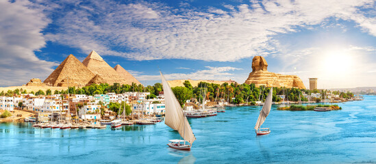 Skyline panorama of Aswan city on the way to the Great Sphinx and Pyramids of Egypt - obrazy, fototapety, plakaty