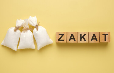 A picture of 3 rice bag with wooden block written 