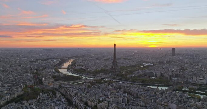 Beautiful view of famous Eiffel Tower in France with colorful twilight romantic sky. Wide establishing aerial morning sunrise or sunset of paris city center best travel destinations landmark in Europe