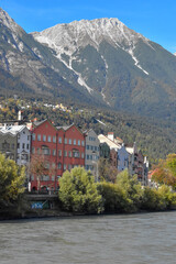 Panoramic view of the historic city center of Innsbruck with colorful houses along Inn river and famous Austrian.