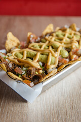 crispy and delicious plate of nachos with sauce