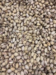 beautifully stacked pistachio nuts in the shell