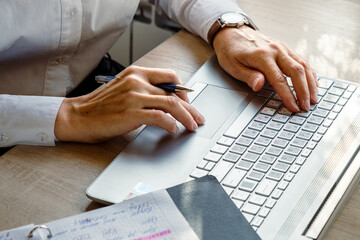 Close up shot, young businesswoman using laptop in coffee shop, crop image of manager busy working...