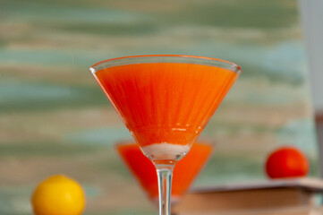 healthy fresh orange juice in cocktail glass, blur background