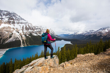 Fototapeta premium Young woman in Peyto lake, Banff National Park, Canada