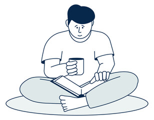 Cozy home reading. Young man with hot drink