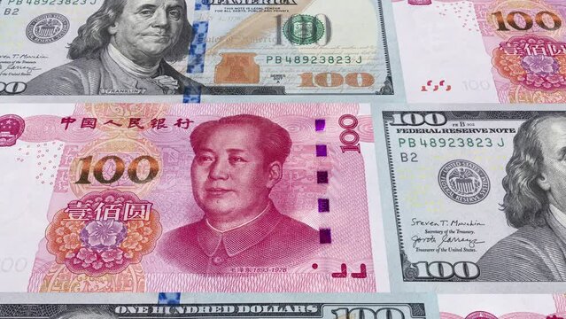 American 100 dollar and Chinese 100 Yuan banknotes moving. Business and Finance concepts. Seamless loopable animation.