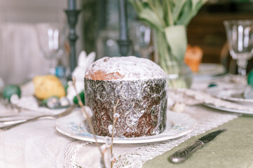 happy easter holiday in springtime season. natural homemade baked cake on plate on table. festive home decor. traditional food. sophisticated country rustic tablscape style
