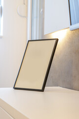 Blank photo frame on table in the room	