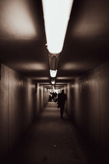 people walking in the tunnel. 