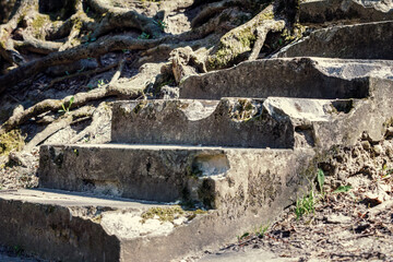 Old staircase made of concrete and rubble, close-up in the park of the old collapsing structure.