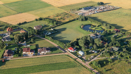 Rural settlement view from above . Flight over village - obrazy, fototapety, plakaty