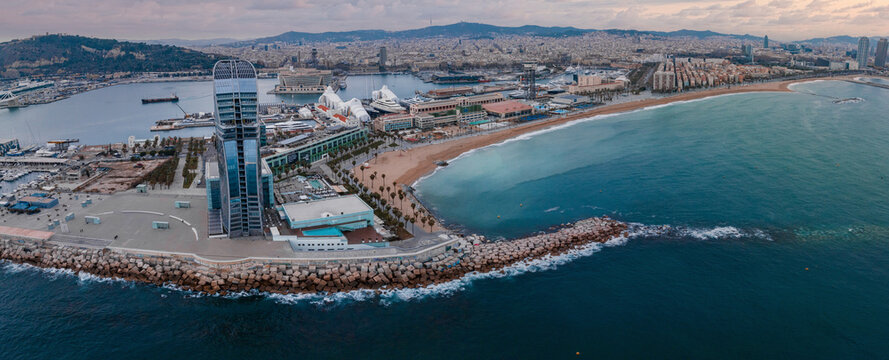 Panoramic aerial view of famous Barceloneta beach with hotel luxury W Barcelona. Birds eye of Barcelona, Catalunya, Spain.