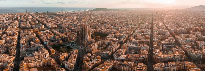 Küchenrückwand glas motiv Aerial view of Barcelona City Skyline and Sagrada Familia Cathedral at sunset. Eixample residential famous urban grid. Cityscape with typical urban octagon blocks © ingusk