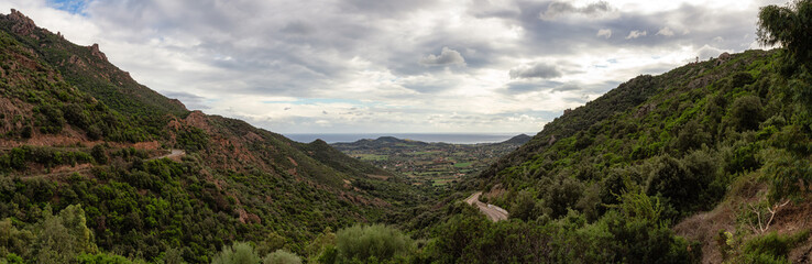Obraz premium Scenic Road in the Mountains on the Sea Coast. Near Foxi Manna, Sardinia, Italy. Panorama