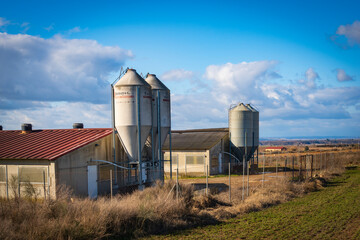 two pig farms with four feed silos
