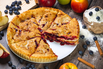 cherry pie on the table with powdered sugar
