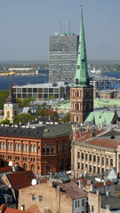 Fototapeta na wymiar Churches and modern buildings . The skyline of Riga.