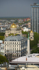 Fototapeta na wymiar The gold onion domes of Riga Nativity of Christ Orthodox Cathedral seen from St Peter's Church
