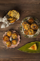 Chocolate chip cookies, muffins, cheesecake top view with beautiful crockery