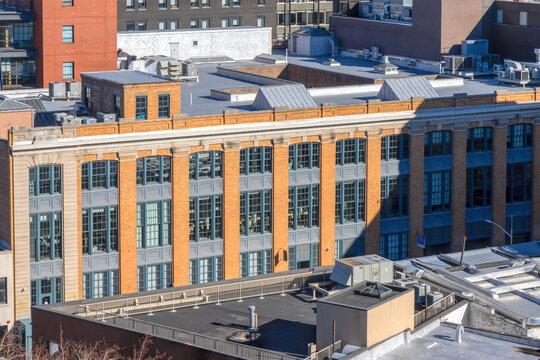 Old multi-storey brick industrial and factory buildings, lower Manhattan, sunny with blue sky and clouds, nobody	