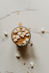 Fototapeta na wymiar coffee and marshmallows spilled on the table creative mess content creator