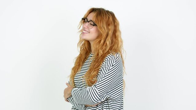Young redhead woman with glasses and happy