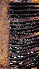 An old rusty tractor grill
