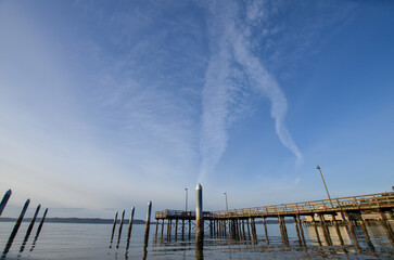 clouds over boardwalk