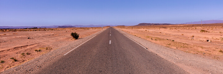 Road to Agadir. Milestone indicating Agadir in a desertic area of Morocco