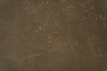 Brown concrete texture. Stone wall background. Surface of the concrete old floor in scratches. High...