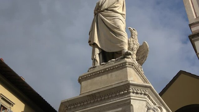 Famous statue of poet Dante Alighieri in front of Basilica Santa Croce Square in Florence Tuscany Italy