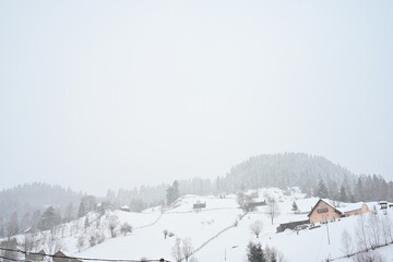Fototapeta na wymiar Heavy snow over mountains in winter time