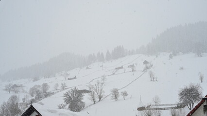 Heavy snow over mountains in winter time