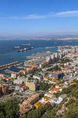 Fototapeta na wymiar Scenic view of Gibraltar city and bay on southern part of Iberian Peninsula, Spain on the horizon. View from top of hill. 