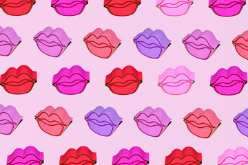 Bath sponges, lips shape, vibrant colors, creative pattern, pastel pink background. Cute girly layout. Summer make up trends idea. 
